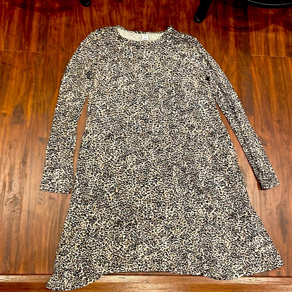 Cheetah print long sleeved dress, a few inches above the knees!